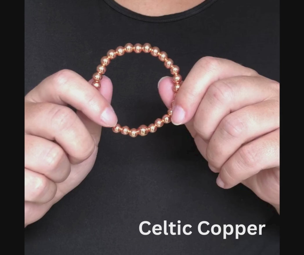 Beaded copper stretch bracelet goes on and off easily. 